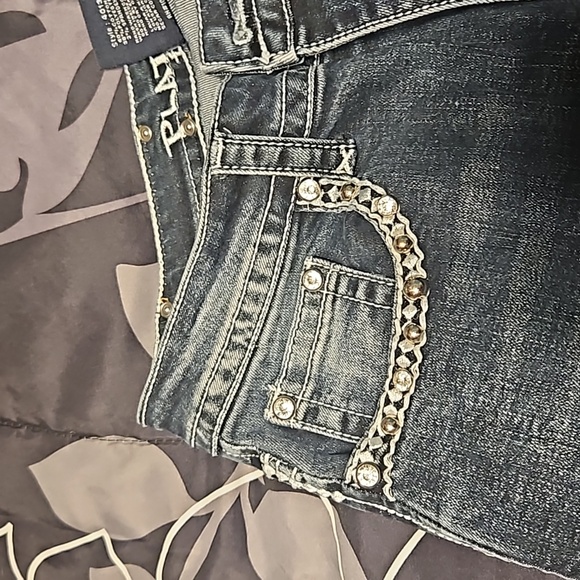 A pair of boot-cut  Platinum Plush jeans - Picture 5 of 11